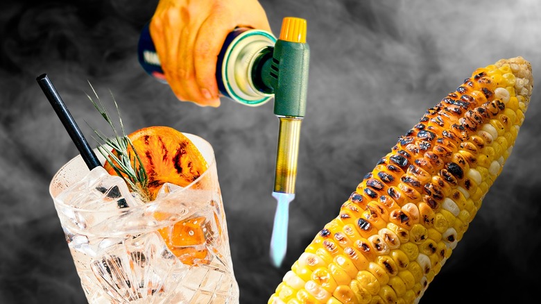 Culinary torch next to corn and orange