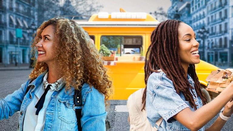 women in front of a food truck