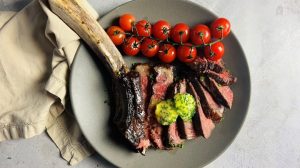 Overview of grilled tomahawk steak on plate