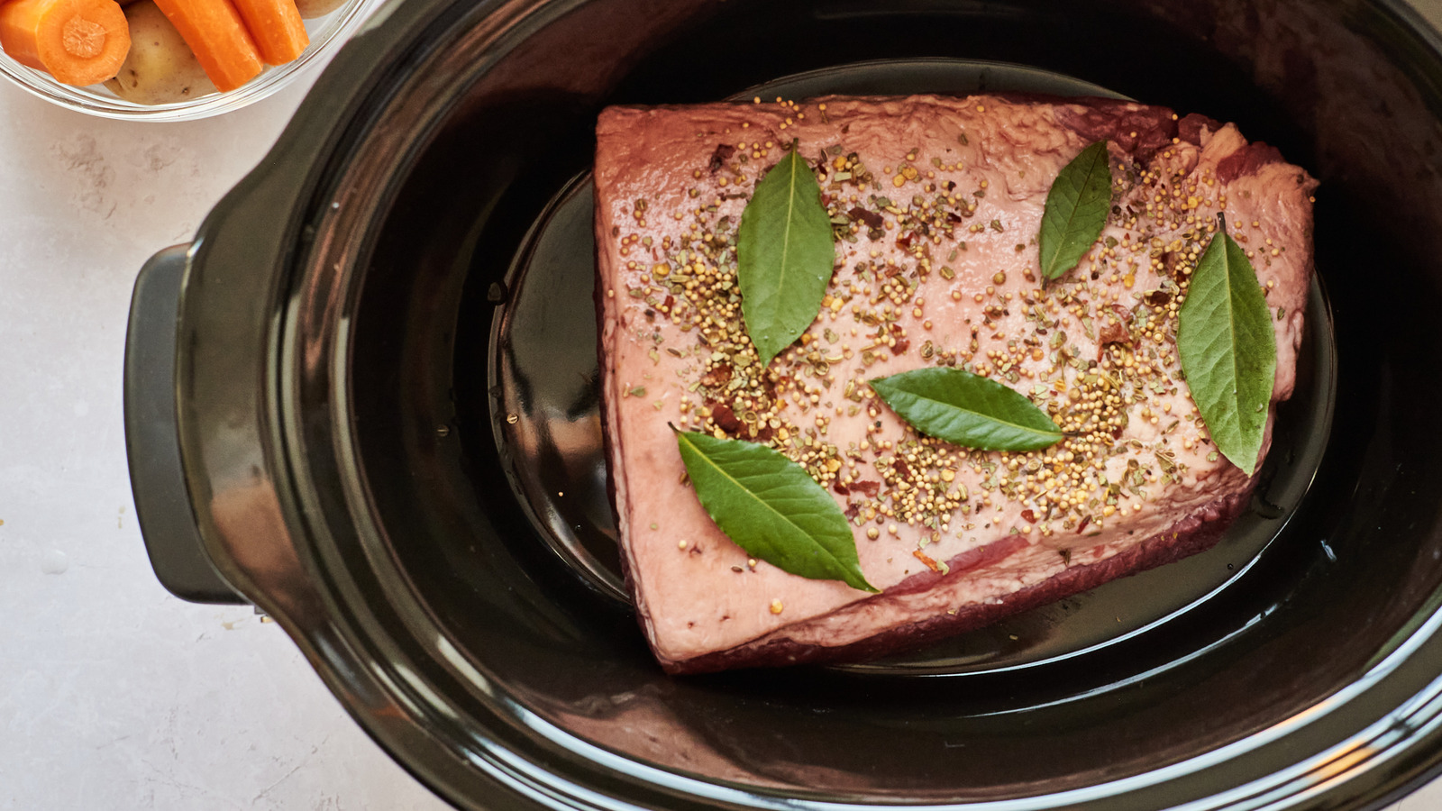 https://www.tastingtable.com/1541630/how-long-cook-corned-beef-slow-cooker/