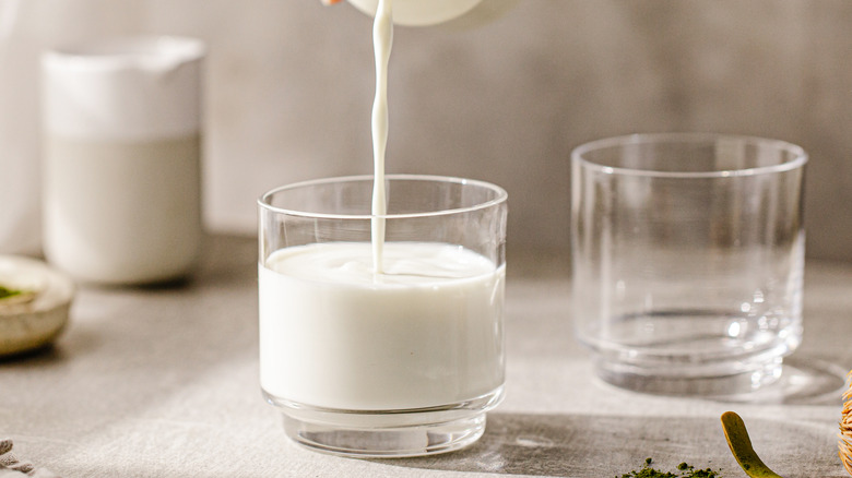 pouring milk into a glass