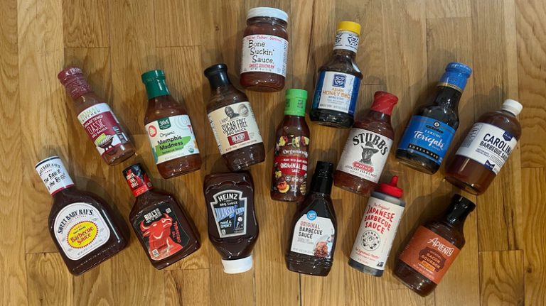 Barbecue sauces on wood background