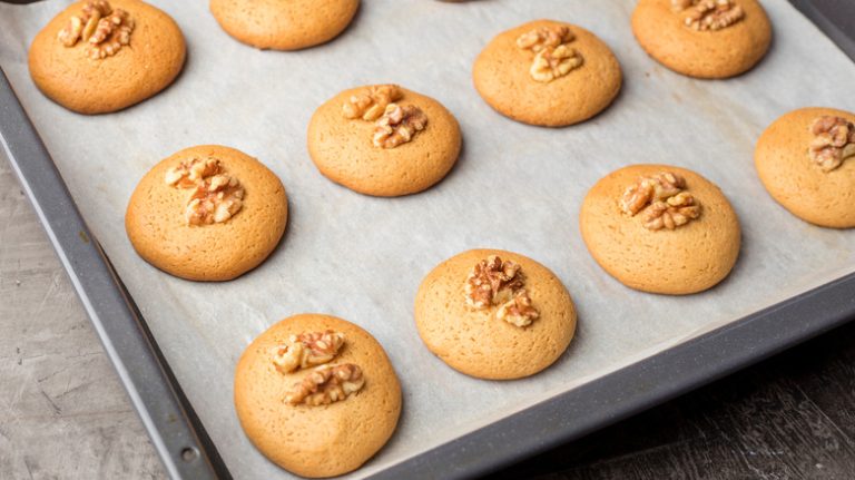 cookies on parchment paper lined tray