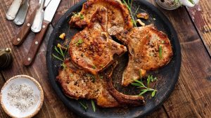 Pan-fried pork chops on plate